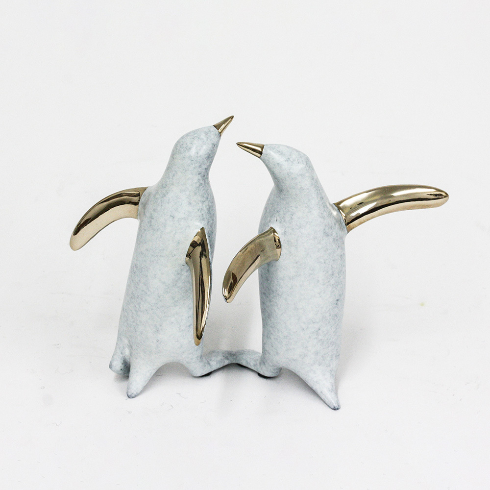 Loet Vanderveen - PENGUIN PAIR (472) - BRONZE - 7 X 4.5 X 5.25 - These sculptures are bronze limited editions.
<br>
<br><a href="/[sculpture]/[available]-[patina]-[swatches]/">More than 30 patinas are available</a>. Available patinas are indicated as IN STOCK. Loet Vanderveen limited editions are always in strong demand and our stocked inventory sells quickly. Special orders are not being taken at this time.
<br>
<br>Allow a few weeks for your sculptures to arrive as each one is thoroughly prepared and packed in our warehouse. This includes fully customized crating and boxing for each piece. Your patience is appreciated during this process as we strive to ensure that your new artwork safely arrives.
<br>
<br>Shipping and Handling TBD