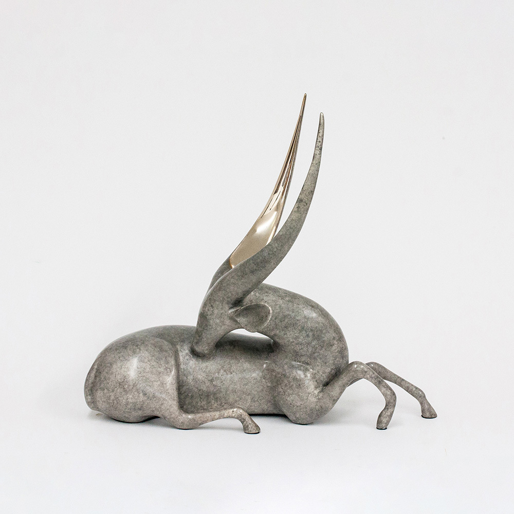 Loet Vanderveen - BUSHBUCK, RECLINING (502) - BRONZE - 18 X 7 X 16 - These sculptures are bronze limited editions.
<br>
<br><a href="/[sculpture]/[available]-[patina]-[swatches]/">More than 30 patinas are available</a>. Available patinas are indicated as IN STOCK. Loet Vanderveen limited editions are always in strong demand and our stocked inventory sells quickly. Special orders are not being taken at this time.
<br>
<br>Allow a few weeks for your sculptures to arrive as each one is thoroughly prepared and packed in our warehouse. This includes fully customized crating and boxing for each piece. Your patience is appreciated during this process as we strive to ensure that your new artwork safely arrives.
<br>
<br>Shipping and Handling TBD