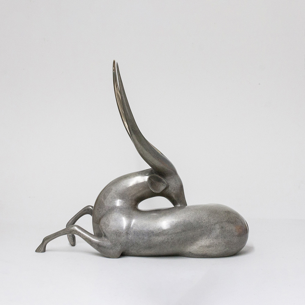 Loet Vanderveen - BUSHBUCK, RECLINING (502) - BRONZE - 18 X 7 X 16 - These sculptures are bronze limited editions.
<br>
<br><a href="/[sculpture]/[available]-[patina]-[swatches]/">More than 30 patinas are available</a>. Available patinas are indicated as IN STOCK. Loet Vanderveen limited editions are always in strong demand and our stocked inventory sells quickly. Special orders are not being taken at this time.
<br>
<br>Allow a few weeks for your sculptures to arrive as each one is thoroughly prepared and packed in our warehouse. This includes fully customized crating and boxing for each piece. Your patience is appreciated during this process as we strive to ensure that your new artwork safely arrives.
<br>
<br>Shipping and Handling TBD