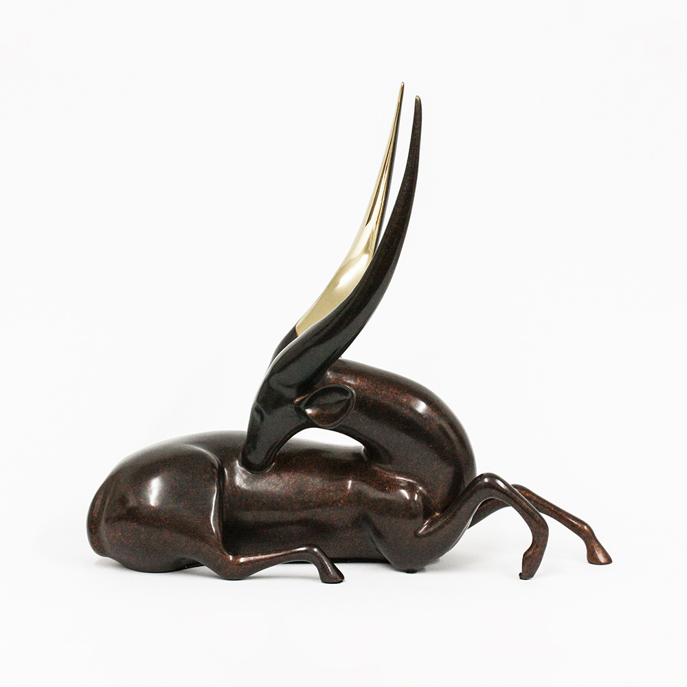 Loet Vanderveen - BUSHBUCK, RECLINING (502) - BRONZE - 18 X 7 X 16 - These sculptures are bronze limited editions.
<br>
<br><a href="/[sculpture]/[available]-[patina]-[swatches]/">More than 30 patinas are available</a>. Available patinas are indicated as IN STOCK. Loet Vanderveen limited editions are always in strong demand and our stocked inventory sells quickly. Special orders are not being taken at this time.
<br>
<br>Allow a few weeks for your sculptures to arrive as each one is thoroughly prepared and packed in our warehouse. This includes fully customized crating and boxing for each piece. Your patience is appreciated during this process as we strive to ensure that your new artwork safely arrives.
<br>
<br>Shipping and Handling TBD