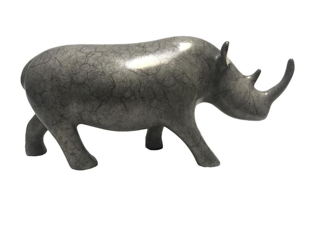 Loet Vanderveen - RHINO, KENYA (555) - BRONZE - 8.25 X 2.75 X 3.75 - These sculptures are bronze limited editions.
<br>
<br><a href="/[sculpture]/[available]-[patina]-[swatches]/">More than 30 patinas are available</a>. Available patinas are indicated as IN STOCK. Loet Vanderveen limited editions are always in strong demand and our stocked inventory sells quickly. Special orders are not being taken at this time.
<br>
<br>Allow a few weeks for your sculptures to arrive as each one is thoroughly prepared and packed in our warehouse. This includes fully customized crating and boxing for each piece. Your patience is appreciated during this process as we strive to ensure that your new artwork safely arrives.
<br>
<br>Shipping and Handling TBD